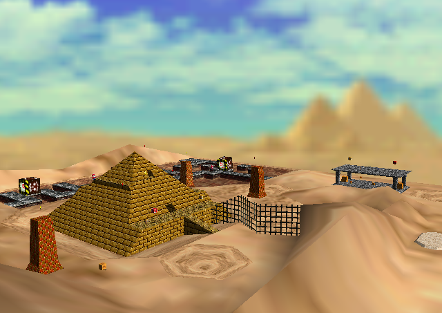 Low poly desert with dunes, some constructions and an egyptian pyramid